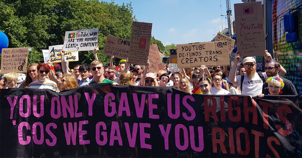 queer action ireland, banner in demonstration saying "you only gave us rights 'cos we gave you riots"